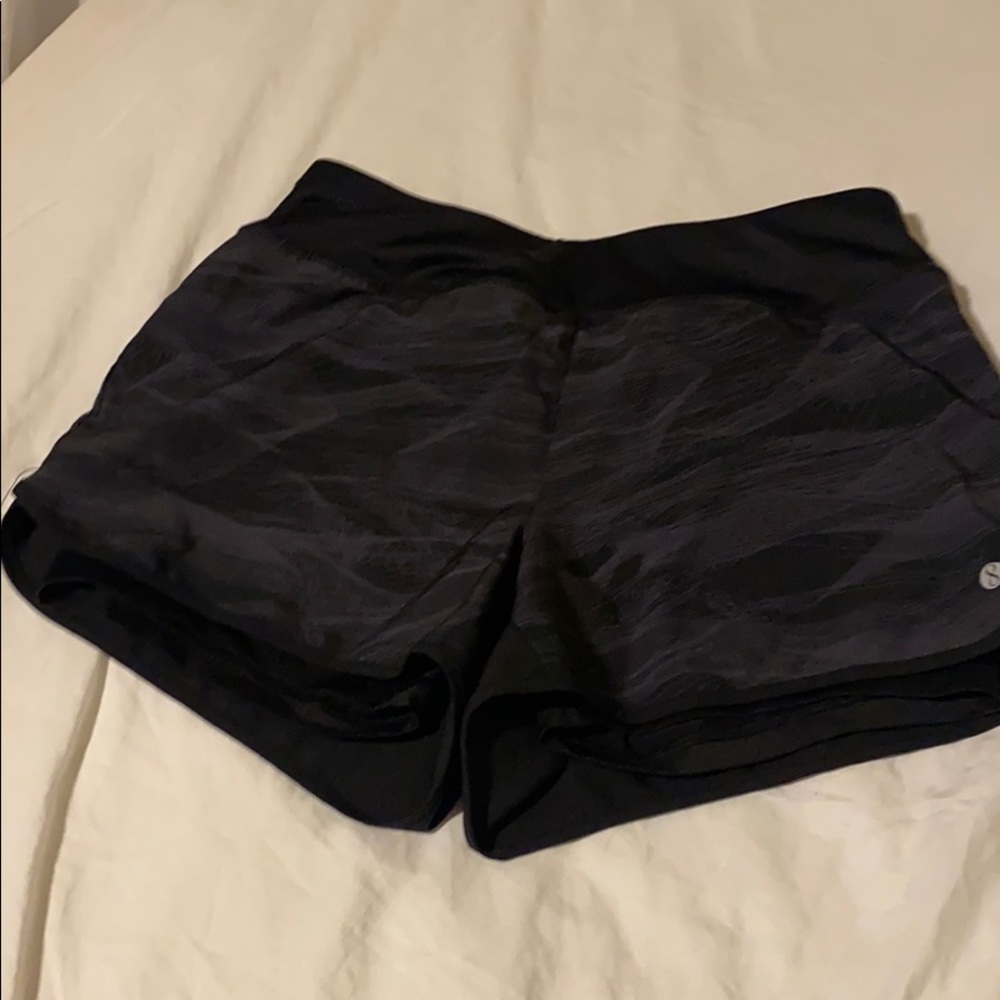 Workout shorts with compression shorts built in